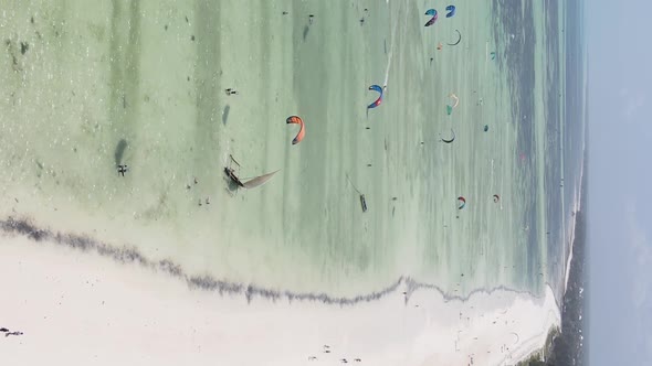 Zanzibar Tanzania  Vertical Video Kitesurfing Near the Shore of Ocean Slow Motion