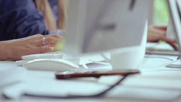 Close Up Shot of Businesswoman Hand Typing and Working on Computer on Desk