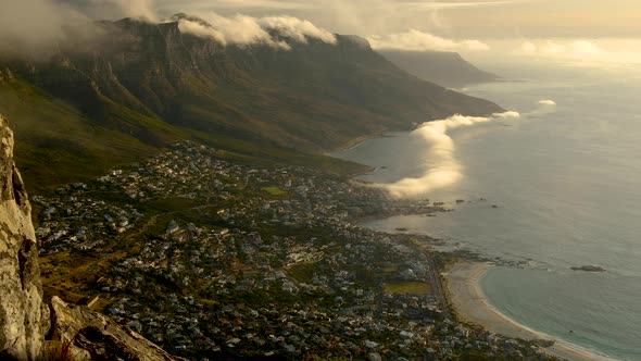 TimeLapse - Awesome cloud formations over mountains and mist flowing in from ocean, Camps Bay, South