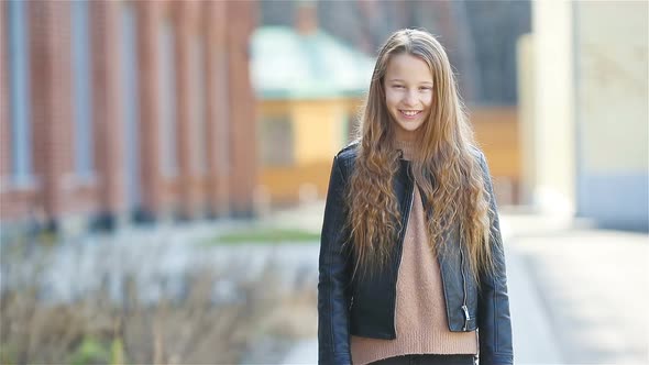 Portrait of Little Girl in the City