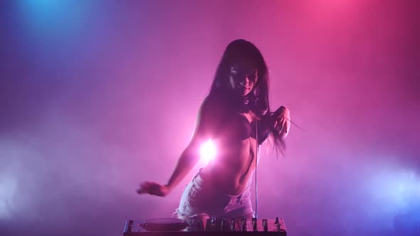 Girl DJ Starts Dancing Blue Pink Lights and a Lot of Smoke