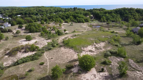 Drone aerial of a sand grass and dune area in Muskegon.