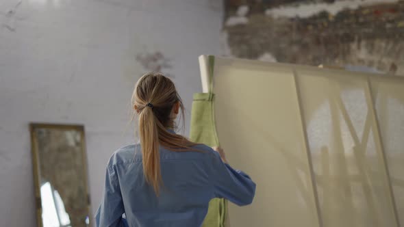 Young Woman Wearing Apron to Start Painting in Workshop