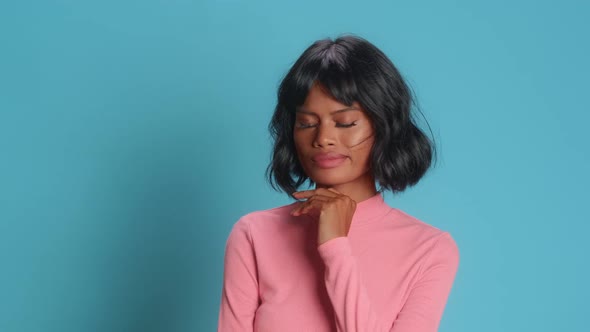 Thoughtful Young Woman Holds Chin Looks Away Pensively Tries to Make Decision