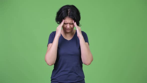 Stressed Woman with Short Hair Having Headache