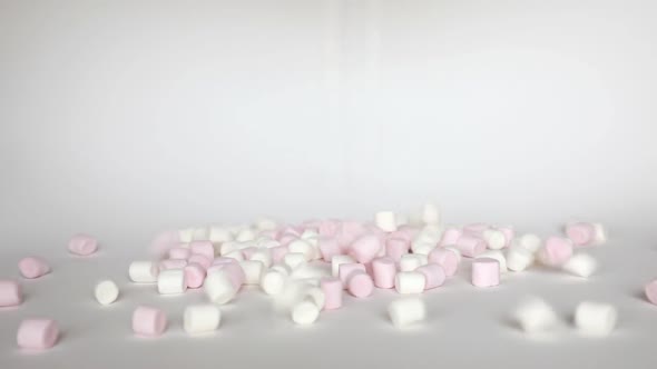 Pink and White Mini Marshmallows Falls on White Background, Sweet Food