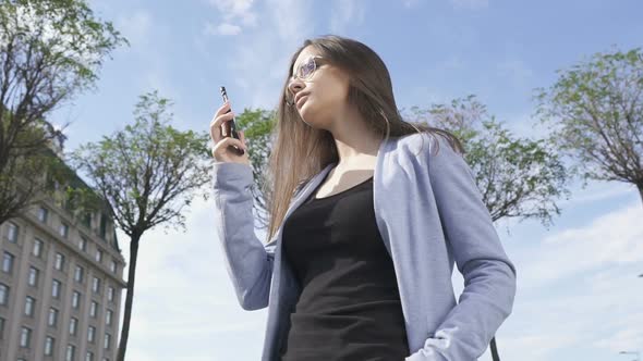 Confident Elegant Lady in Sunglasses Calling Phone, Enjoying Communication