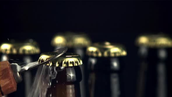 Super Slow Motion Opener Open a Bottle of Beer with Splashes and Foam