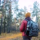 Woman Walks Around Autumn Forest - VideoHive Item for Sale