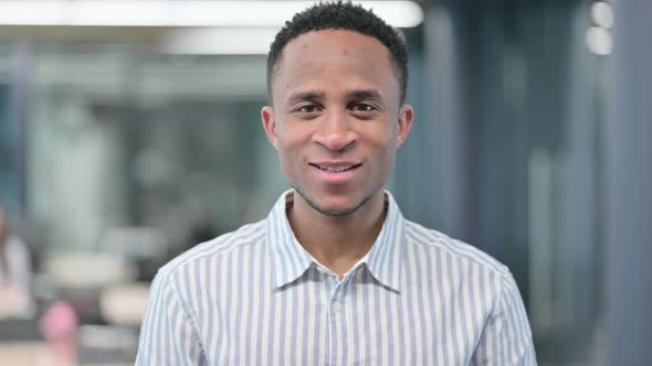 African Businessman Smiling at Camera