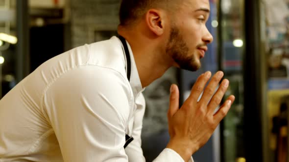 Waiter sitting in cafe 4k