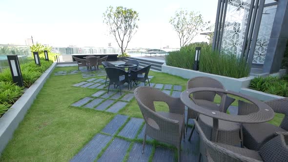 Modern Style Garden on the Buiding Rooftop with Clear Blue Sky Background