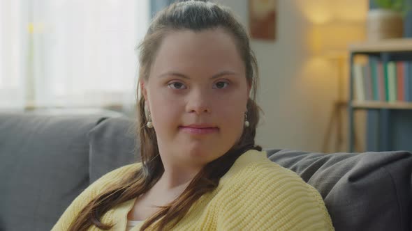 Portrait of Girl with Down Syndrome at Home