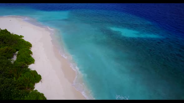 Aerial view tourism of tranquil shore beach journey by blue green water with clean sandy background 