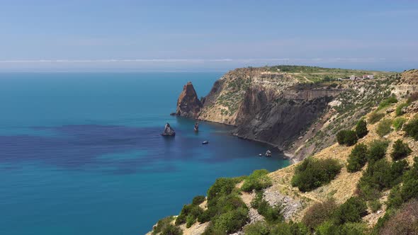 Aerial Panoramic View of Seascape with Crystal Clear Azure Sea and Rocky Shores