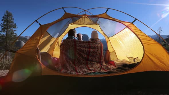 The Couple of Lovers Embracing Inside the Tent at a Dawn in the Yosemite National Park.