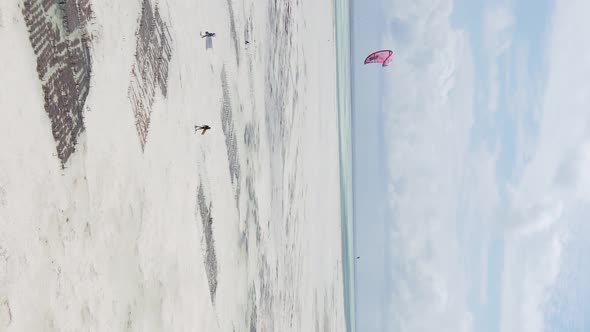 Vertical Video Kitesurfing Near the Shore of Zanzibar Tanzania Aerial View