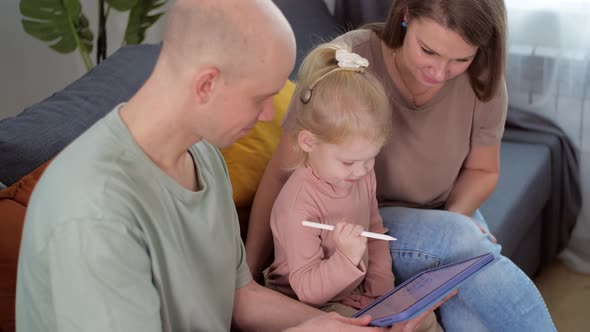 Kid with Cochlear Implants Playing with Tablet Pc at Home