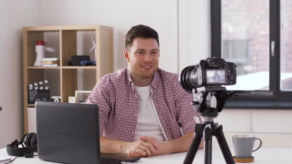 Male Blogger with Camera Videoblogging at Home