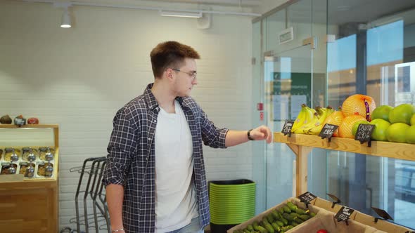 Man Buying Fresh Fruit at Greengrocer