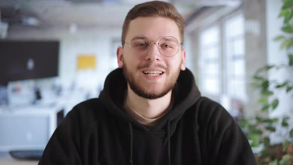 Portrait of Happy Manager in Office