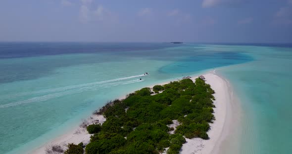 Luxury drone island view of a white sandy paradise beach and aqua blue water background in colourful