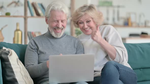 Old Couple Reacting to Loss While Using Laptop at Home