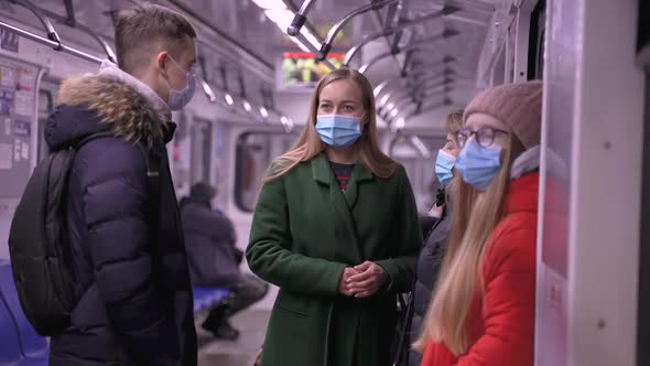 Young People in Face Masks in Underground Carriage