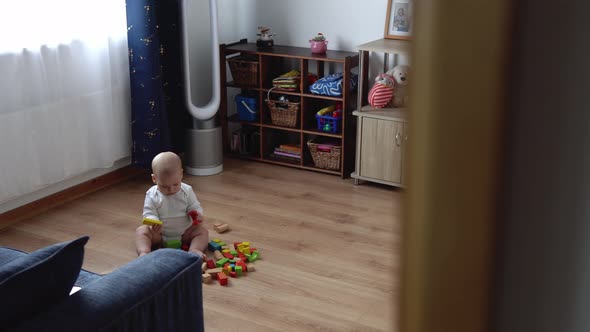 Happy Newborn Baby In Playing Room