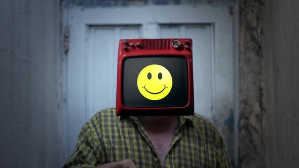 Man with Old TV Instead of Head and an Emoji on Screen.