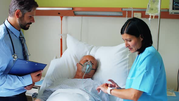 Doctor and nurse interacting with patient