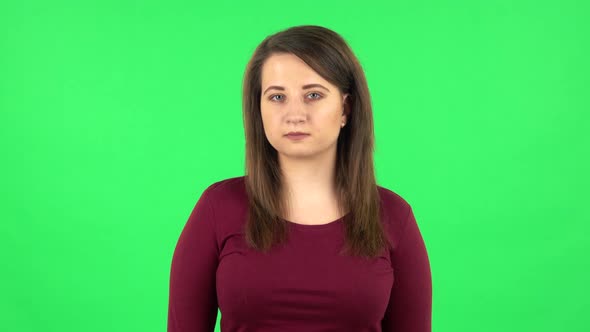 Portrait of Pretty Girl Looking at Camera. Green Screen