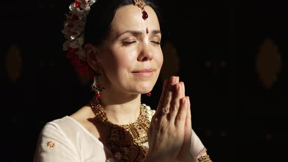 Hare Krishna Woman in Namaste Position