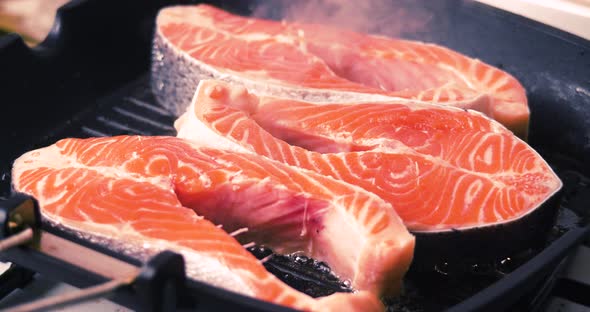 Trout Steaks Pieces on a Frying Pan