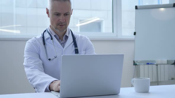 Doctor Working on Laptop