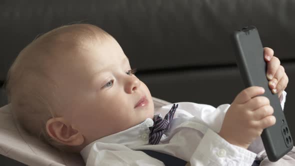 Child Having Fun Playing with Mobile Device Oneyearold Baby Boy Holding Mobile Phone Portrait of