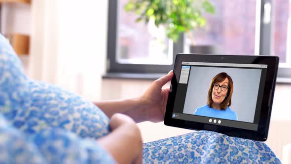 Pregnant Woman with Tablet Pc Having Video Call