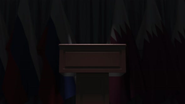 Row of Flags of Qatar and Russia and and Speaker Tribune alt