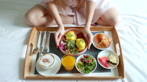 Breakfast in Bed Served with Cup of Coffee Salad Fresh Fruits and Egg Benedict