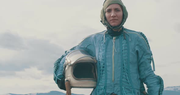 Woman Pilot With Helmet On Hand