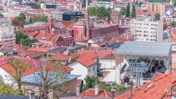 City panorama with cable car moving up and down from Sarajevo station to mountains, Bosnia