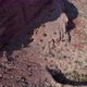 Drone tilts up revealing road on side of cliff in Colorado National Monument - VideoHive Item for Sale