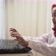a cute little girl wearing red hijab typing on laptop with headphone - VideoHive Item for Sale