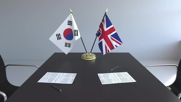 Flags of South Korea and Great Britain and Papers alt