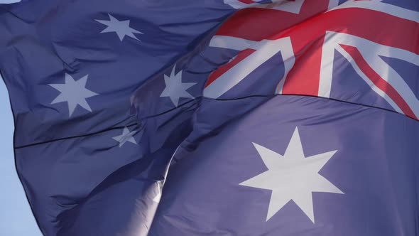 The national australian flag waving in the wind.