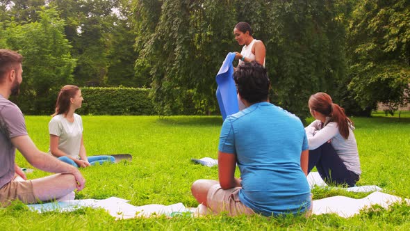 Group of People Meeting for Yoga Class at Park