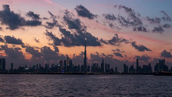 View of Burj Khalifa Skyline From the Dubai Creek Harbour Sunset Timelapse