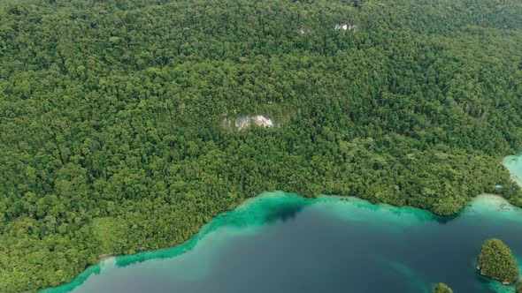 Triton Bay With Turquoise Sea And Green Tropical Trees In Kaimana Islands. 