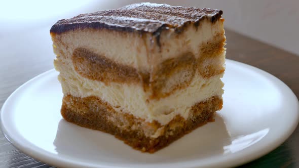 Sweat Mascarpone Tiramisu Cake on a White Plate