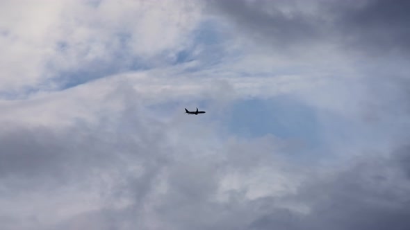 The plane takes off against a cloudy sky